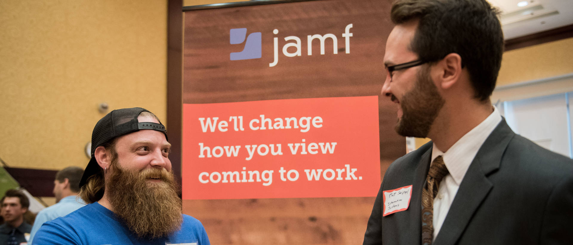 Jamf employee talking to make student at Career Conference