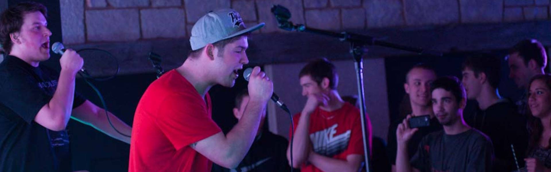 Open mic night at The Cabin, male student singing