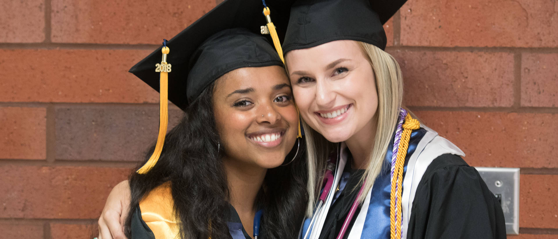Two females at commencement