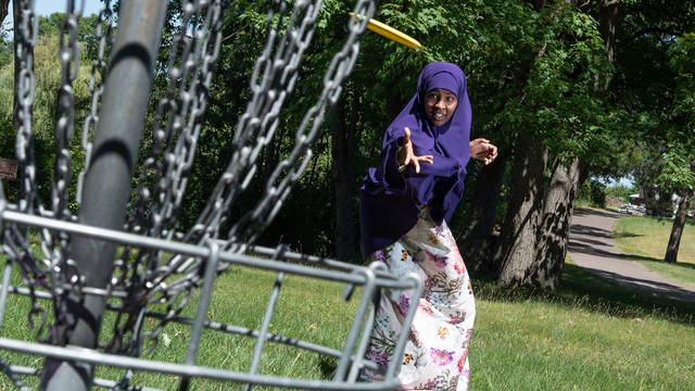 Student playing frisbee golf, Barron County campus