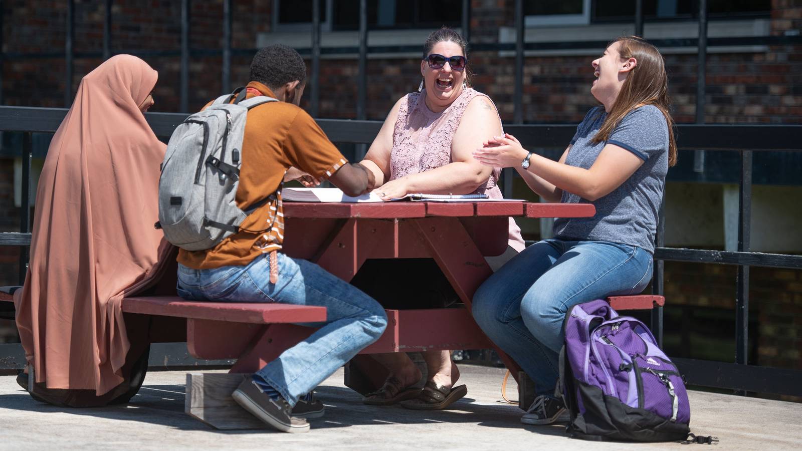 Students at picnic table, Rice Lake campus