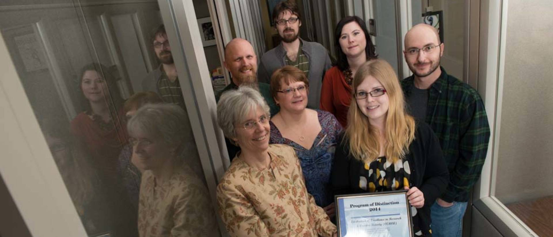 (left to right, front row), Karen Havholm, Ann Statz, business manager, Carissa Beckwith, office assistant, Chris Zimmerman, graduate assistant (left to right, back row), Jeremy Miner, Erik Williams, graduate assistant, Heather Johnson-Schmitz