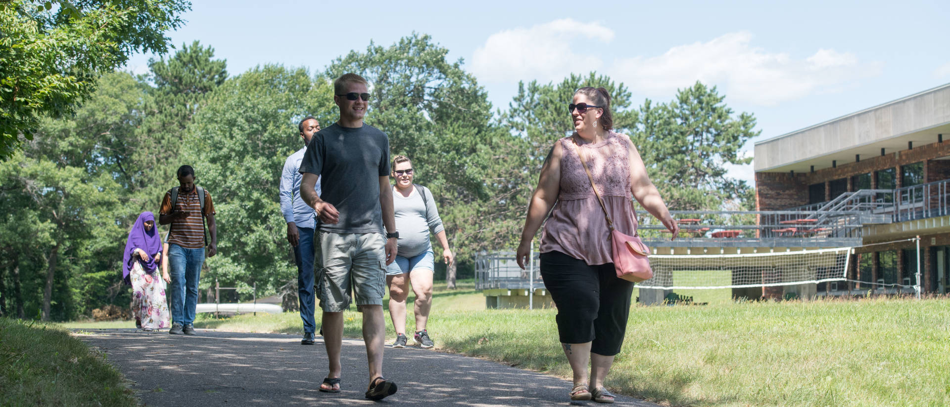UW-Eau Claire – Barron County students walk across campus on a summer day.