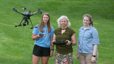 Dr. Patricia Cleary and students with drone