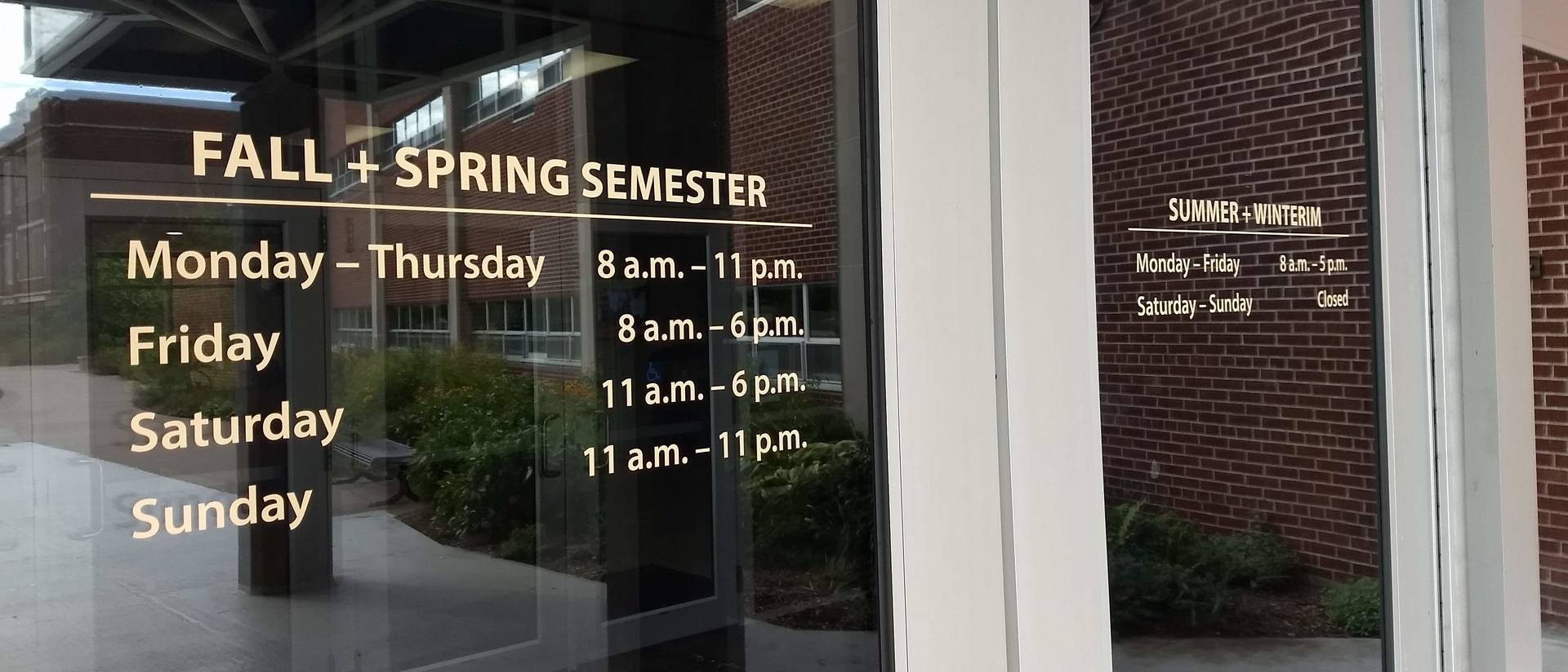 library hours posted on the campus mall door
