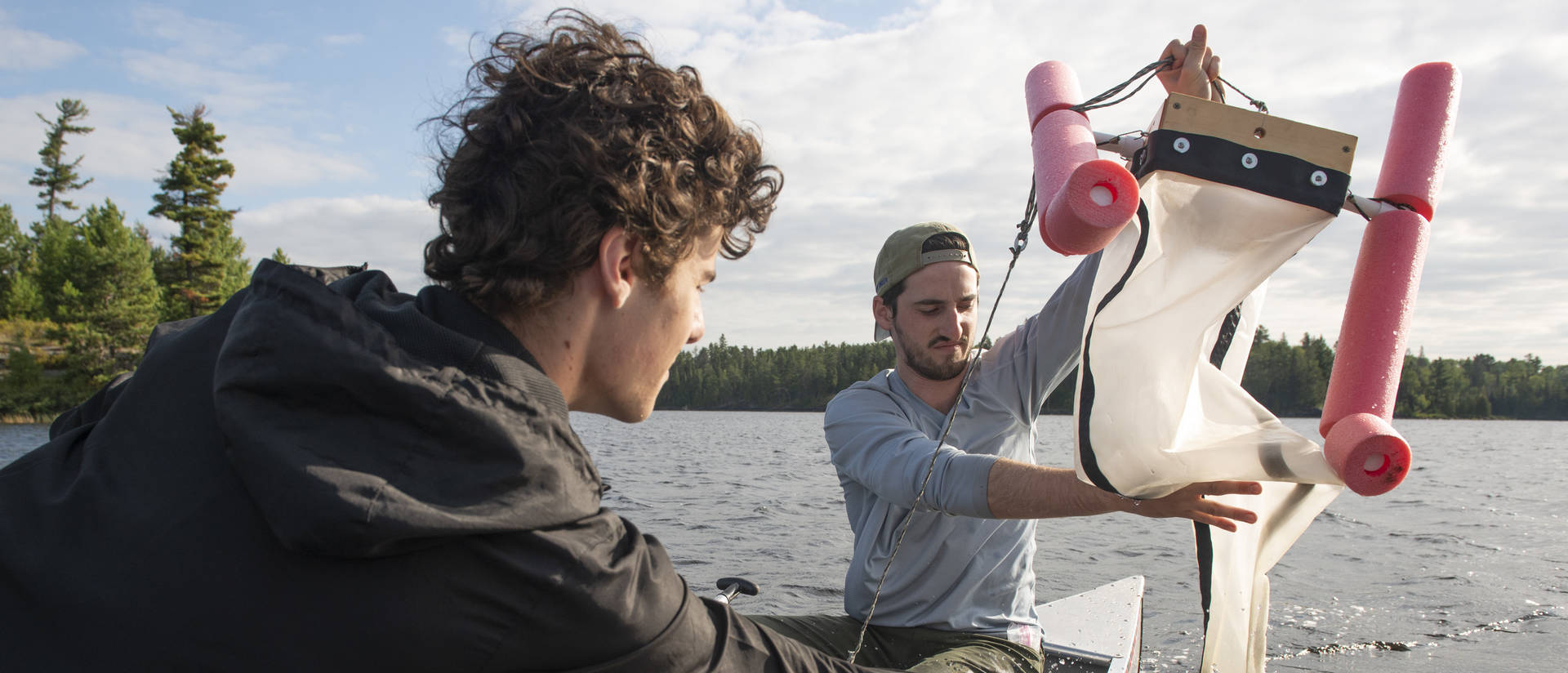 UW-Eau Claire students Reed Kostelny (left) and Thomas Adams are part of a research team that found microplastics in earthworms, water and soil in the Boundary Waters.