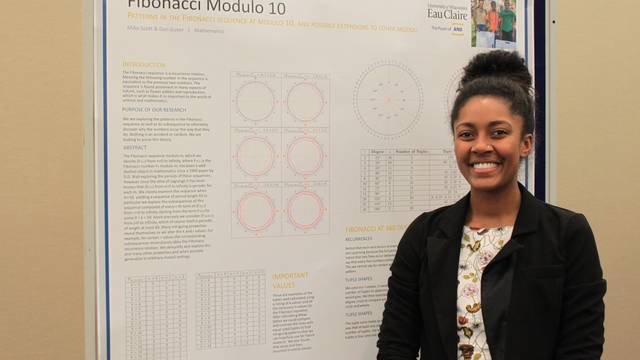 Miko Scott with Research Poster