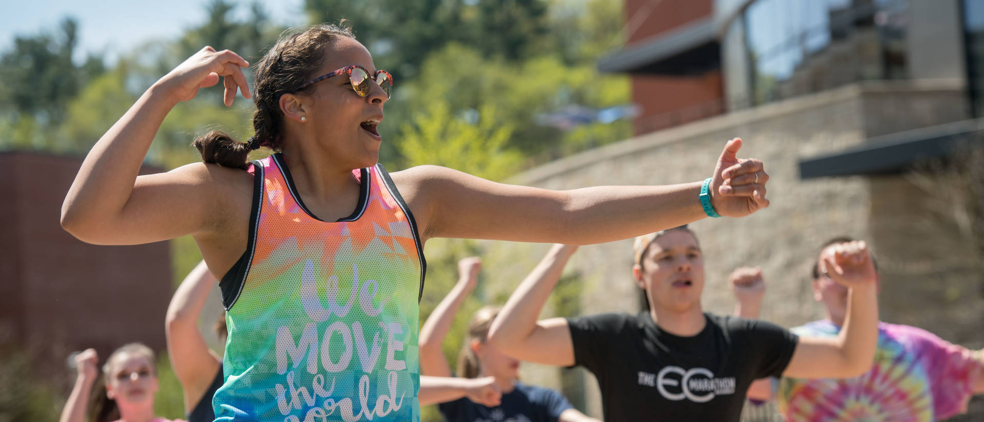 Students doing Zumba on lower campus mall