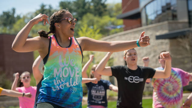 Students doing Zumba on lower campus mall