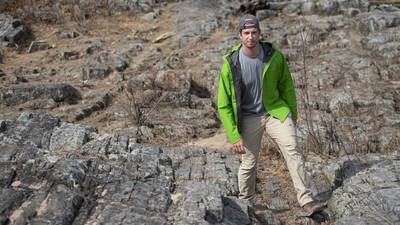 Trevor Nelson hiking among rocks