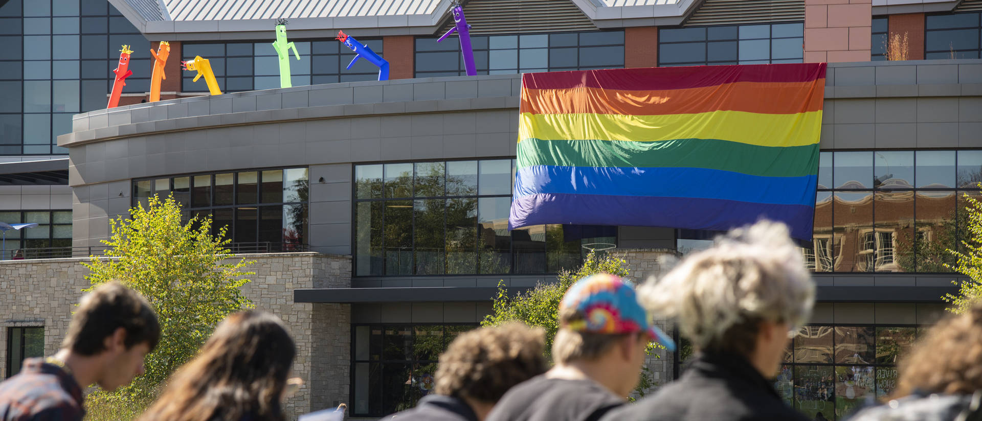 Pride flag on Davies Center facing campus mall