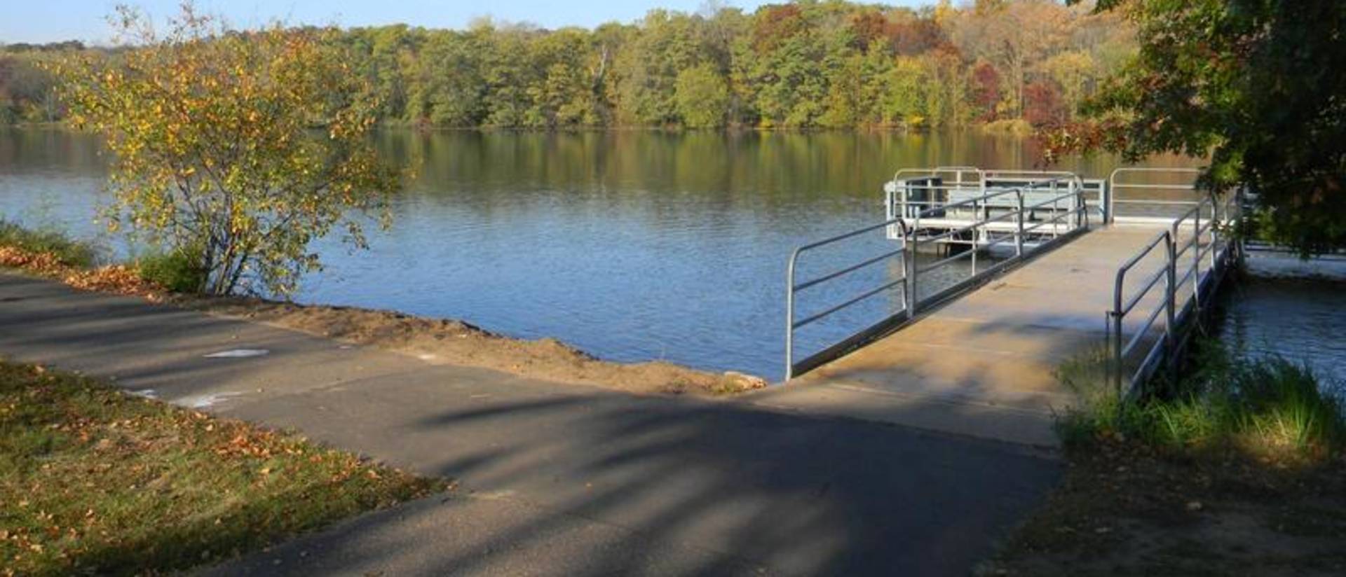 This image, part of McIntyre Library’s "ADA30: Accessibility in the Chippewa Valley" online exhibit, depicts the Braun's Bay accessible boat launch into Half Moon Lake in Eau Claire.