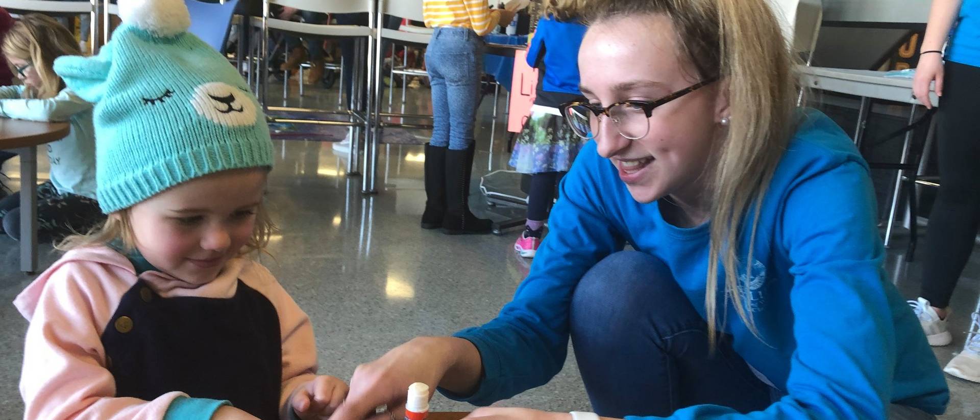 UW-Eau Claire student Allison Mulroy works with a child during an ECLIPSE session.