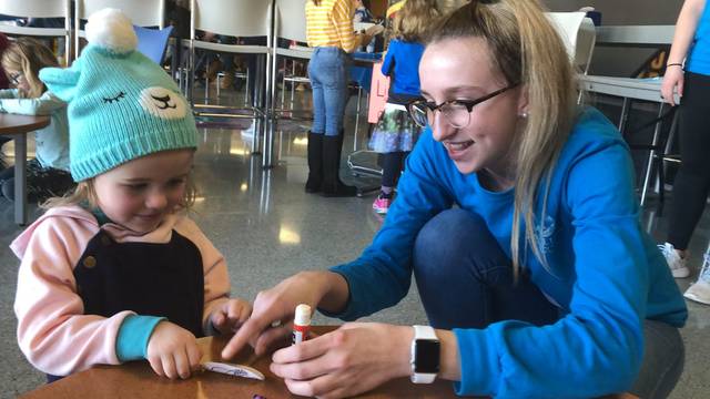 UW-Eau Claire student Allison Mulroy works with a child during an ECLIPSE session.