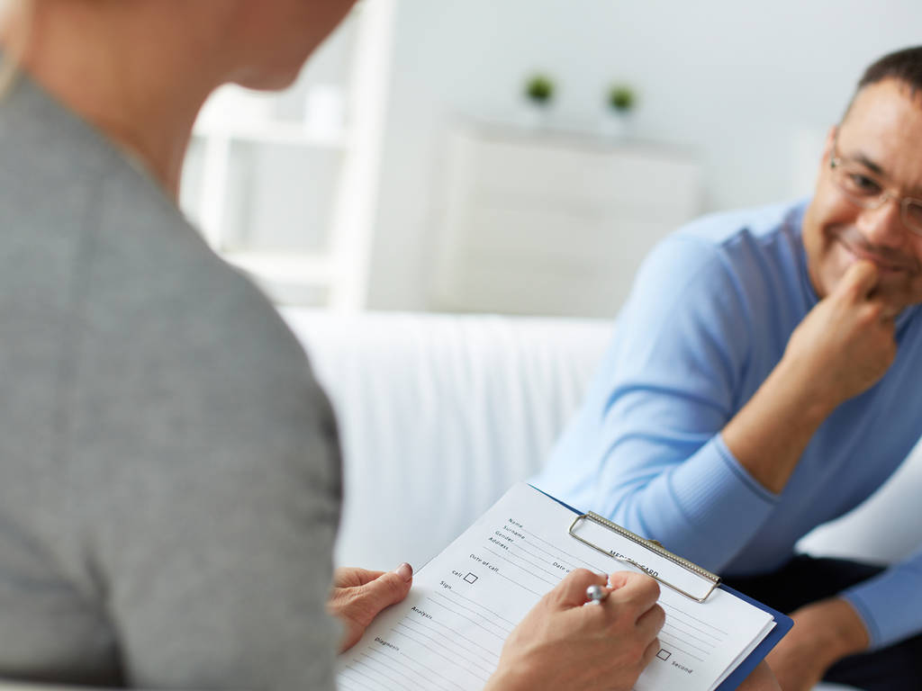 two people having an interview/meeting while one takes notes