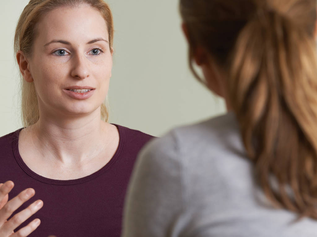 two women conversing