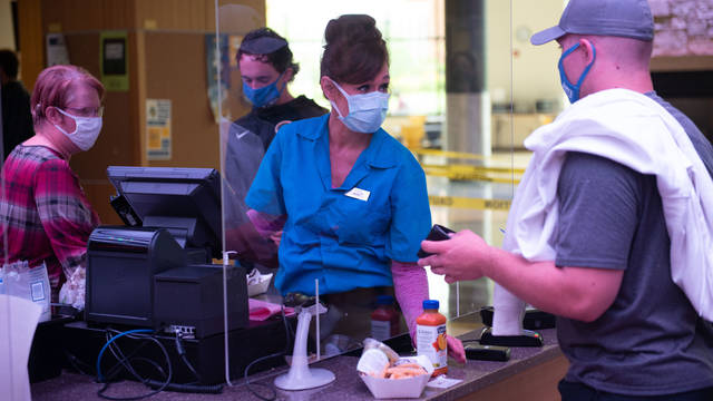 Student buying food from Marketplace during pandemic