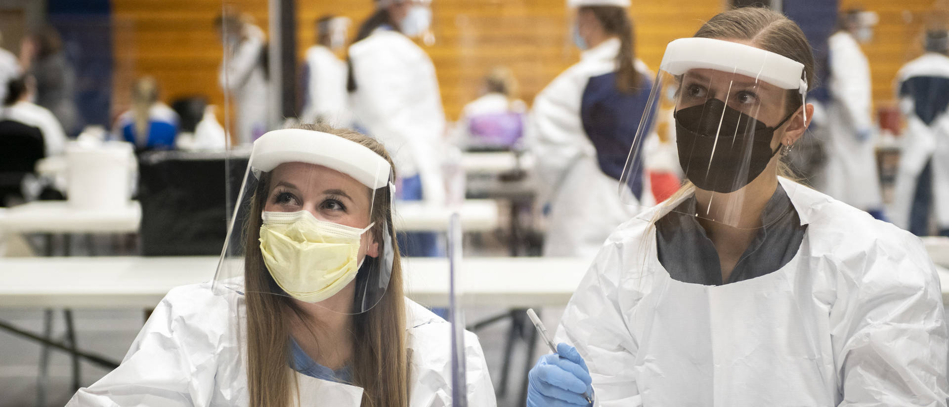 Student nurses working vaccine clinic on Zorn Arena