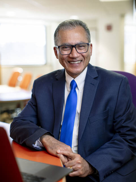 Dr. Rajeev Chaudhry at desk