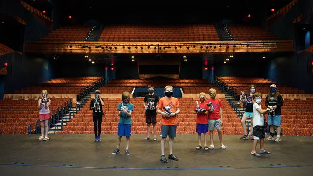 K12 students on Pablo's RCU stage with robotics