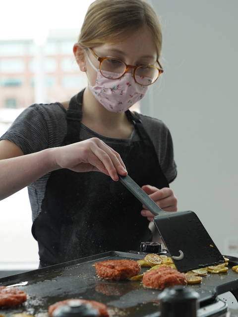 Female K12 student in culinary class at Pablo Center