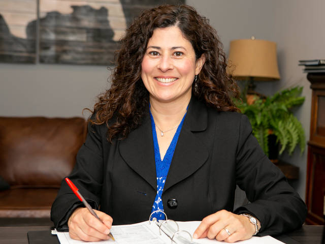 Olga Diaz at desk