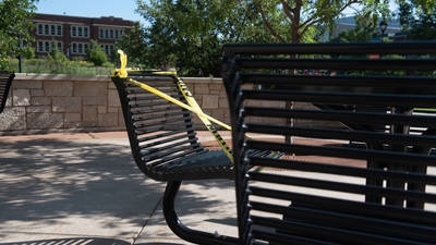 table on patio roped off for COVID