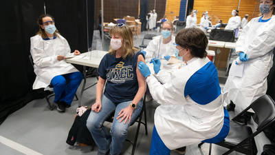 Staff person getting vaccine