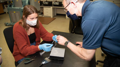 Doug Dunham and studnet in 3D printing lab