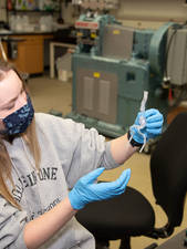 Student holding 3D mocel of an aortic anyeurism