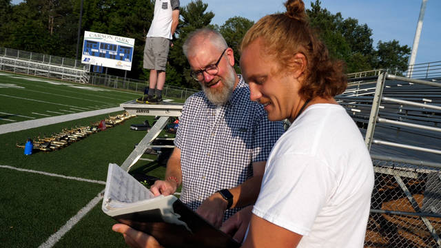 Music professor Dr. Jeff Crowell (left) collaborated with Andrew Smits, a music education major who plays in the Blugold Marching Band, on a summer research project, “Blugold Marching Band Formation Research Project.”