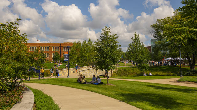 Campus mall with students in fall