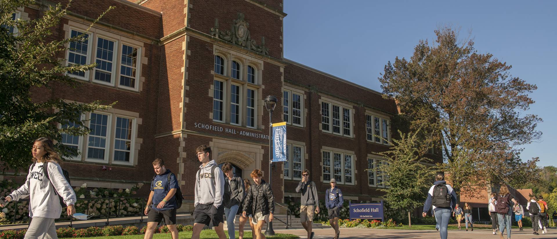 Campus mall with Schofield Hall in fall