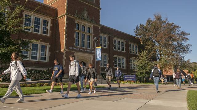 Campus mall with Schofield Hall in fall