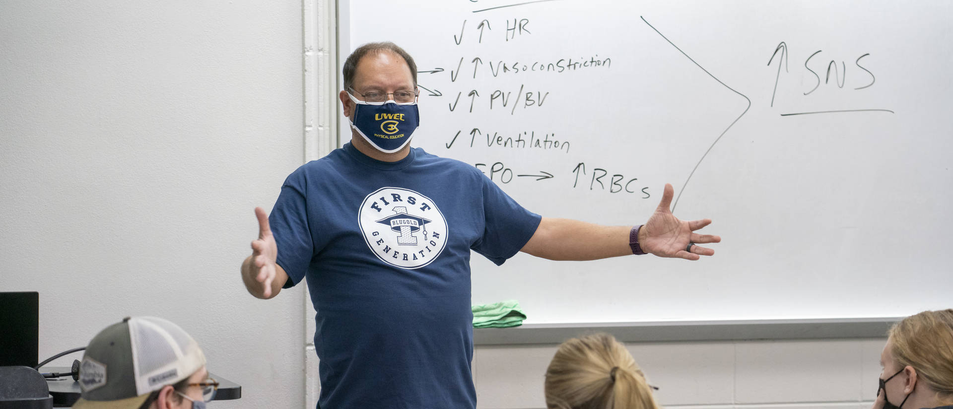 Professor Jeff Janot wearing a first-generation T-shirt and teaching.