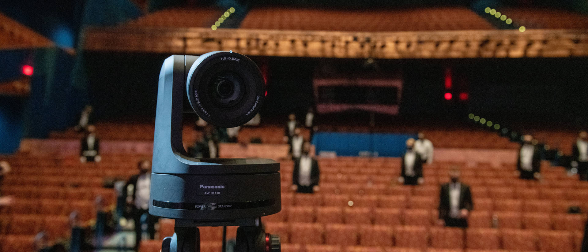Photo of a camera in front of theatre seats