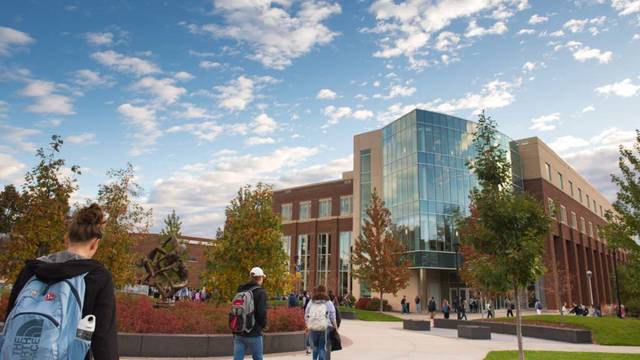 Photo of students walking to Centennial Hall