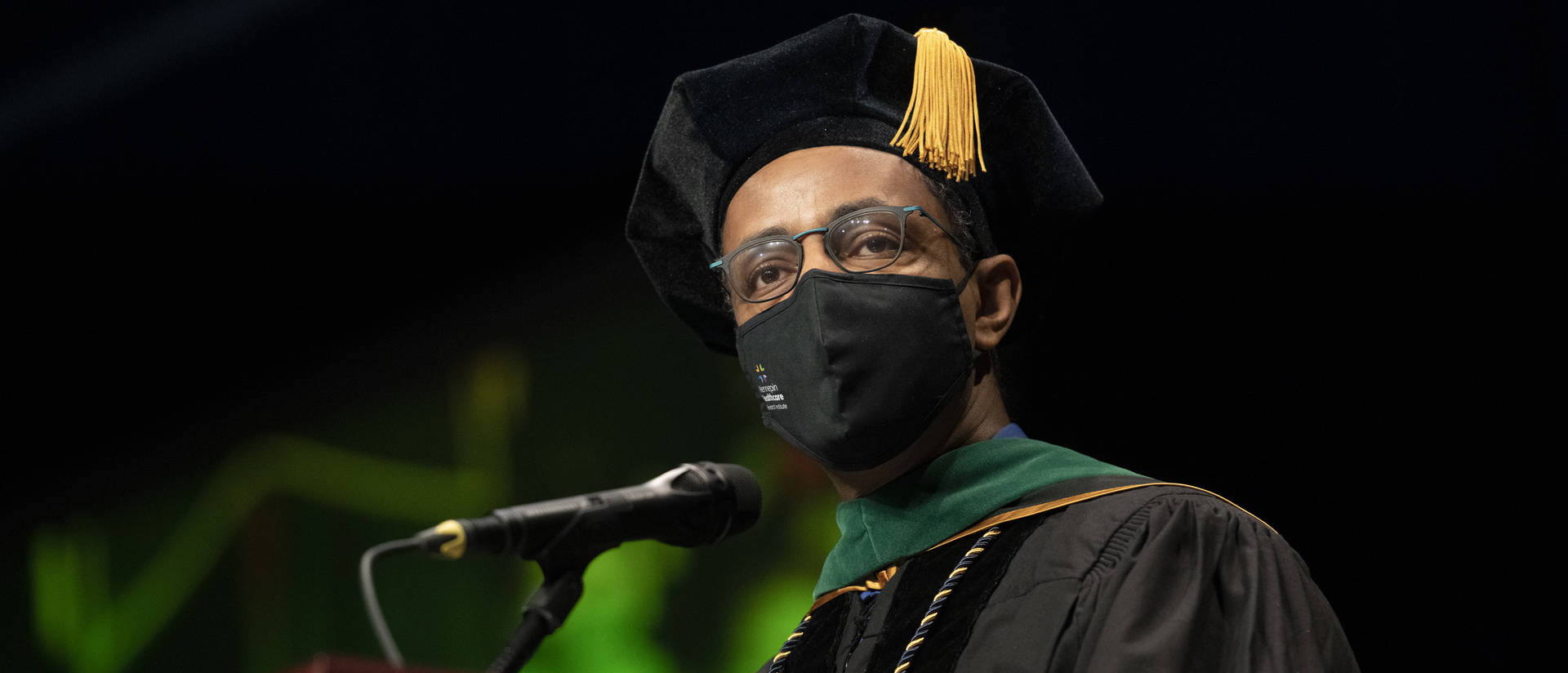 During his “Charge to the Class,” Dr. Woubeshet Ayenew, a 1992 graduate and respected Minneapolis cardiologist, challenged UW-Eau Claire’s newest graduates to find a career that “ignites your core and brings you alive.” (Photo by Shane Opatz)