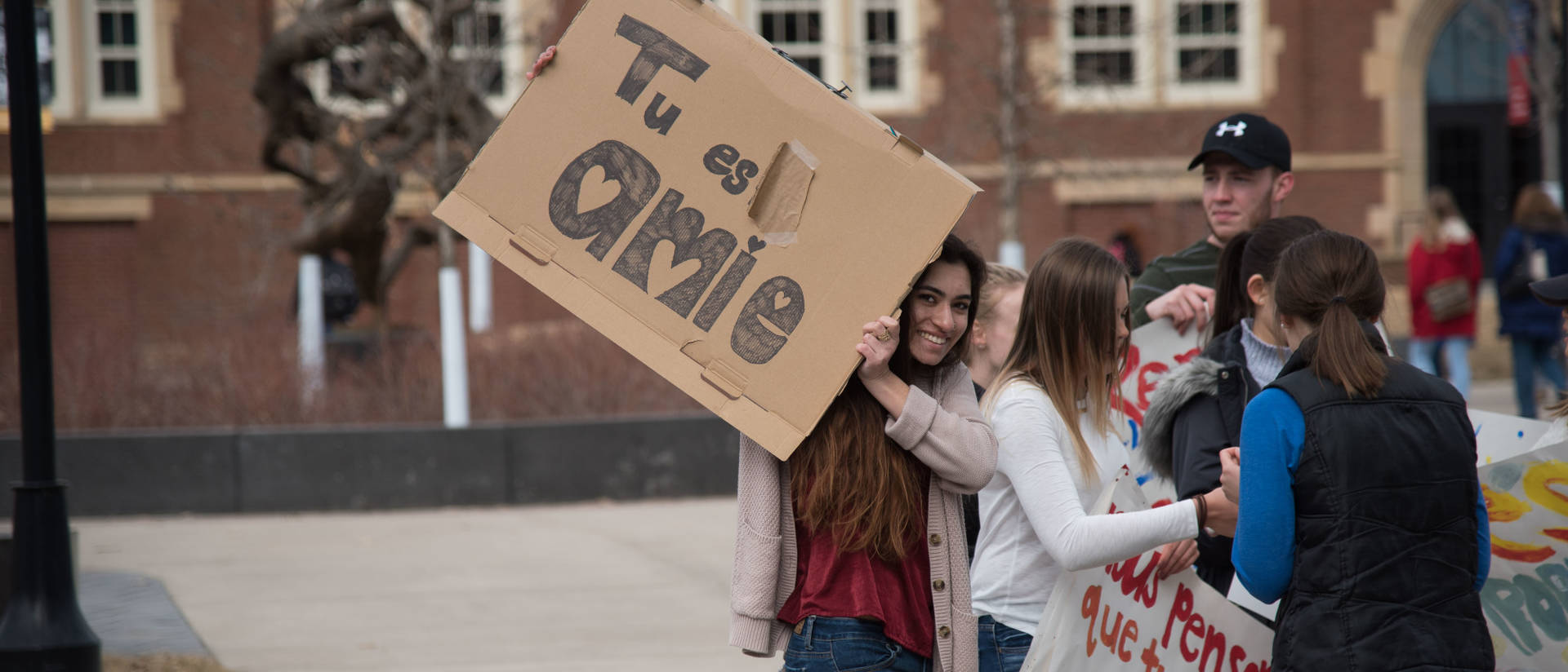 French students spreading positivity via signs on campus