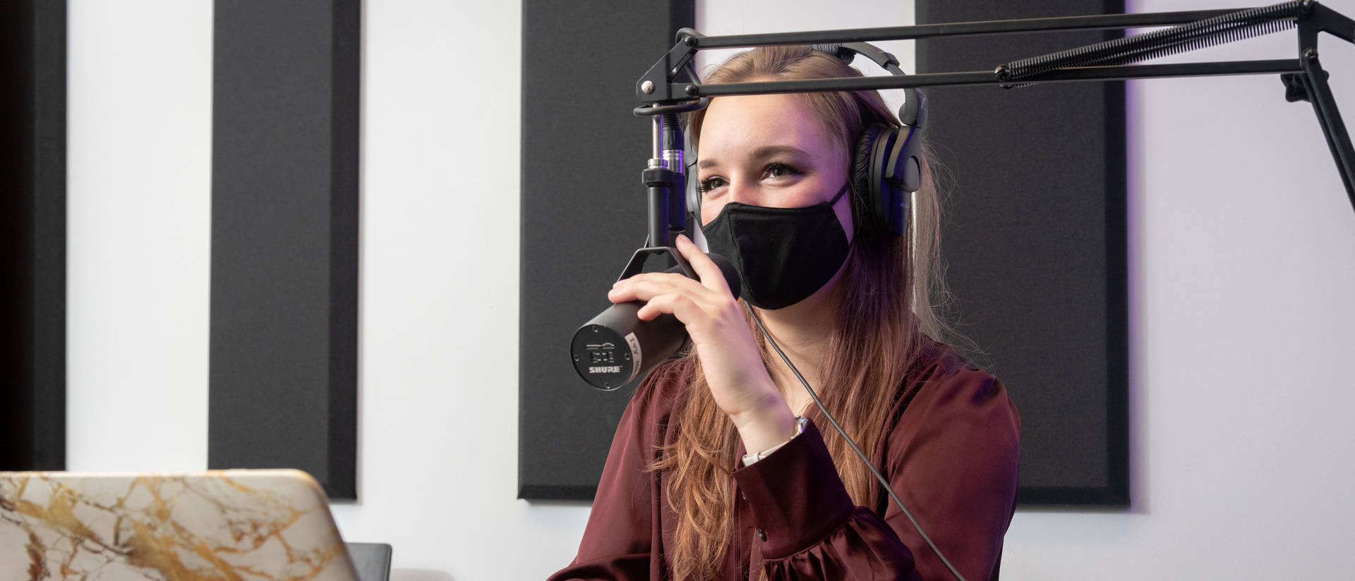 Marketing student recording a podcast