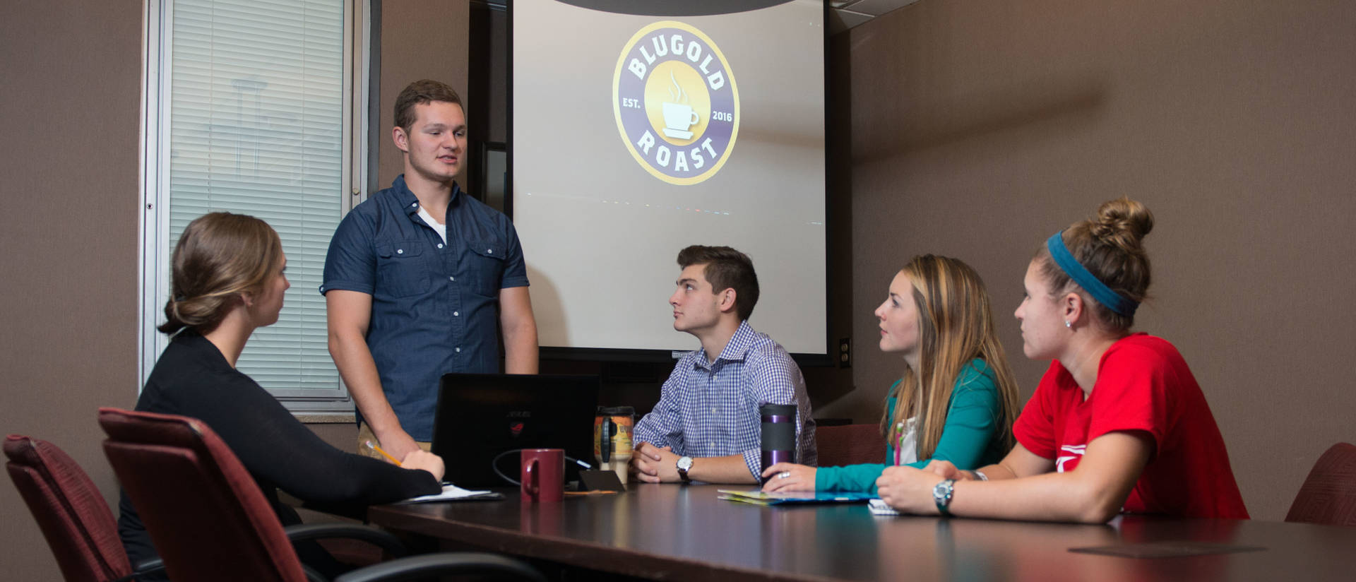 Students discuss Blugold Roast, an LLC that began at UWEC