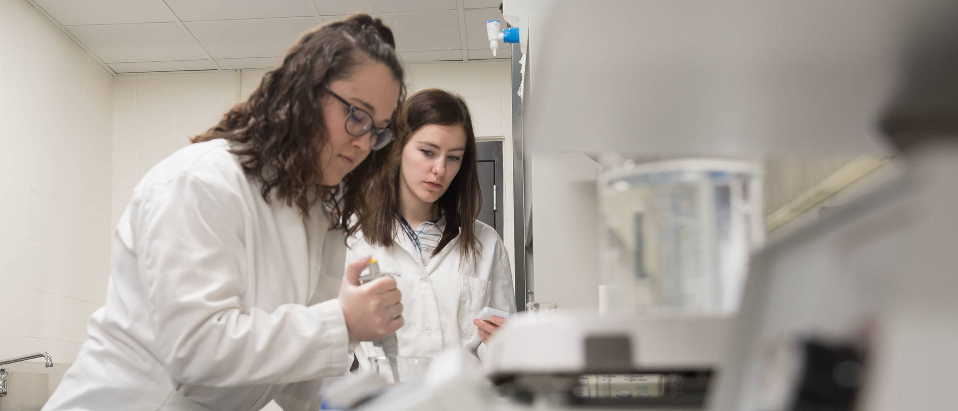 Two Neuroscience students working in the lab