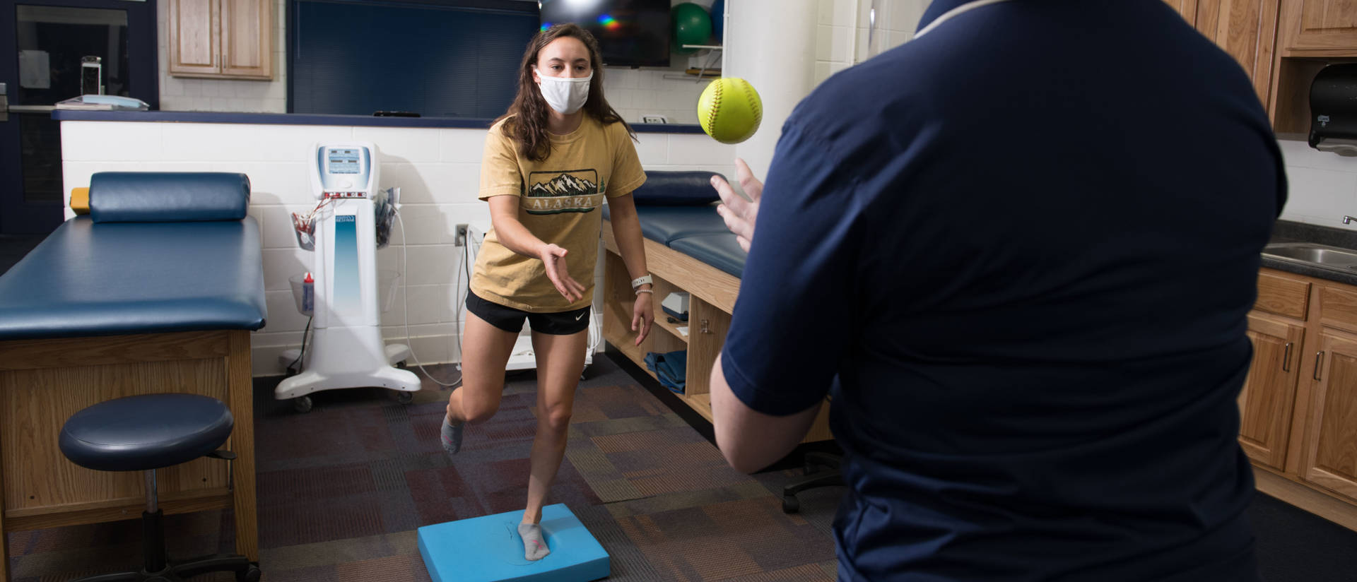 Athletic training students practicing rehabilitation techniques