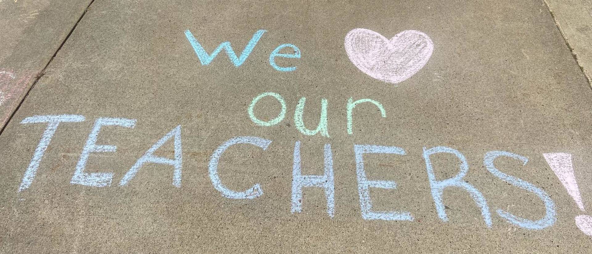 Sidewalk chalk art the says we heart our teachers