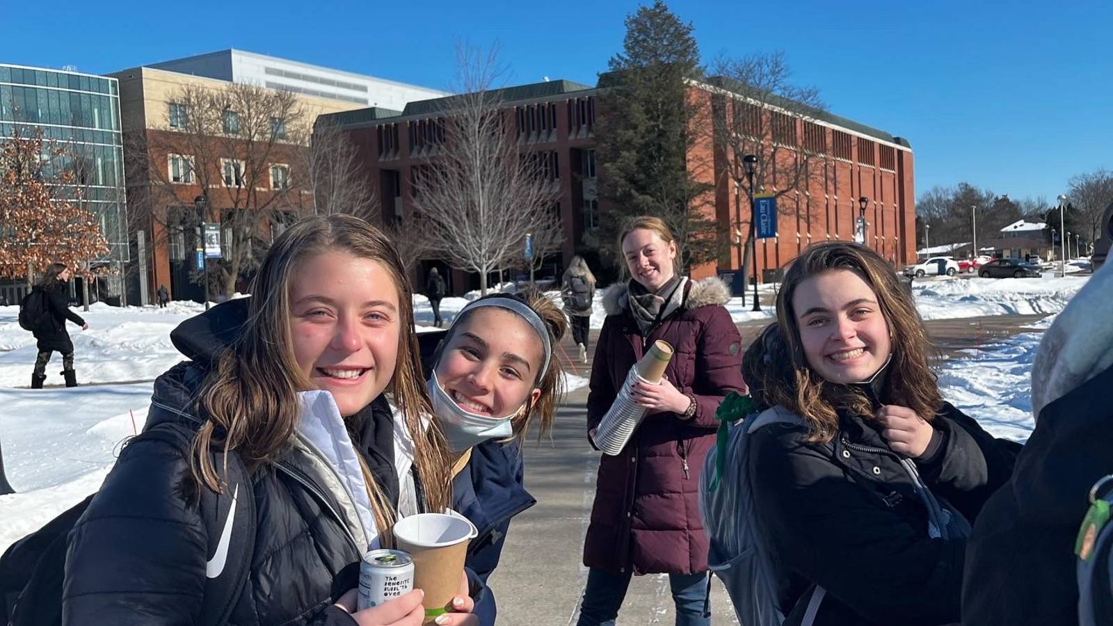 students smiling outside in winter