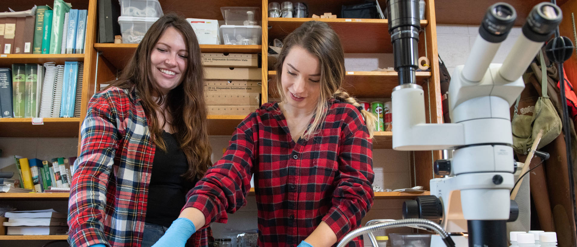 Biology students working with samples in a lab