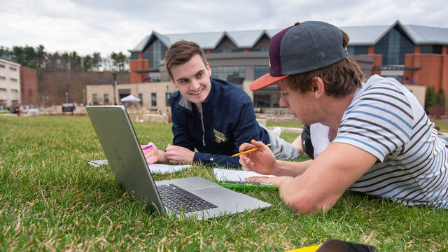 Finance students studying outside