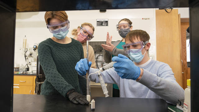 A UW-Eau Claire undergraduate research team that includes (from left) Grace Cunningham, Kira Haus, Dr. Elizabeth Glogowski and Marshall Apps will share its research with a national audience at Posters on the Hill in Washington, D.C. (Photo by Shane Opatz)