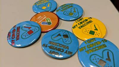 Makerspace Lasercut Covid Buttons.
