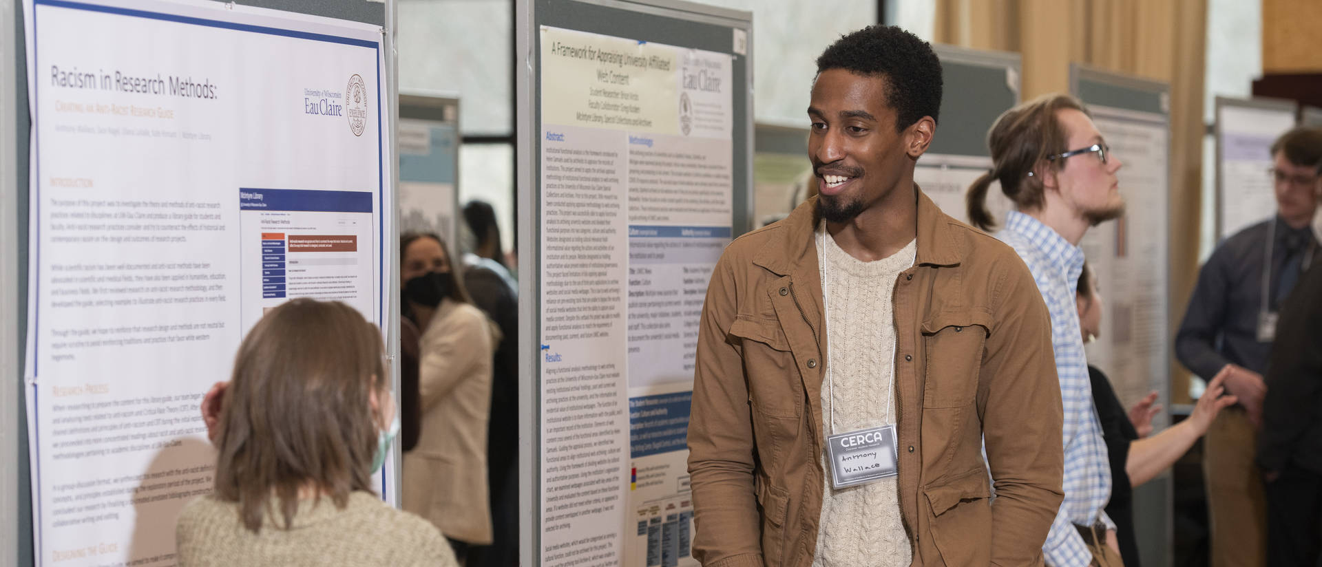 Male student presenting research at CERCA poster event